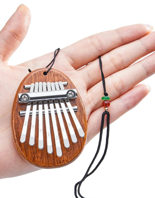 Load image into Gallery viewer, Mini Kalimba 8-Key Thumb Piano - Portable Water Drop Design, Ideal Gift Set for Children
